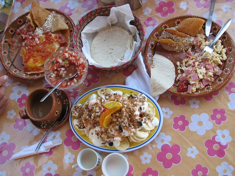 IMG_4219 Breakfast of tortillas, eggs, refried beans, salsa, tropical fruit and yogurt at Vortex Cafe.