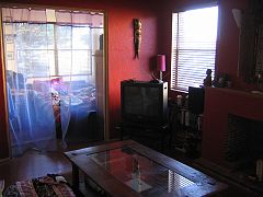 IMG_4163 Romina's lounge, my bedroom is through the curtains.