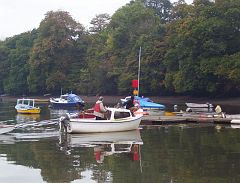 100_4595 After a 12-hour sleep we head down to Stoke Gabrial for a day out on the boat. The boys fetch the boat from the mooring so that the ladies may alight.